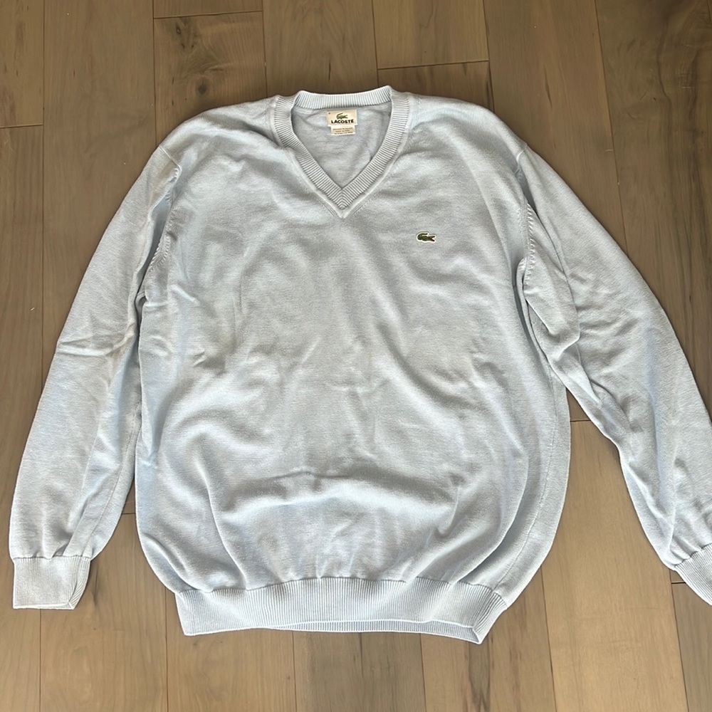 Light blue Lacoste sweater.